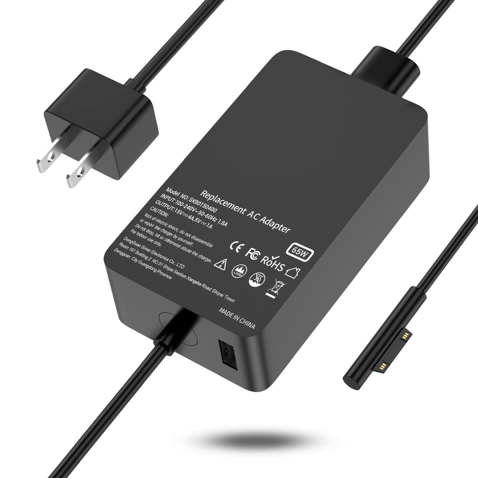 Ryaobwu 65W laptop charger on desk powering a Surface device.
