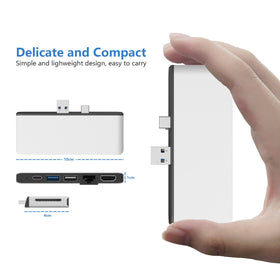 Rytaki hub beside Surface Pen showing compact size and portability