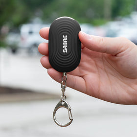 SABRE clipped to backpack strap for on-the-go safety visibility benefit