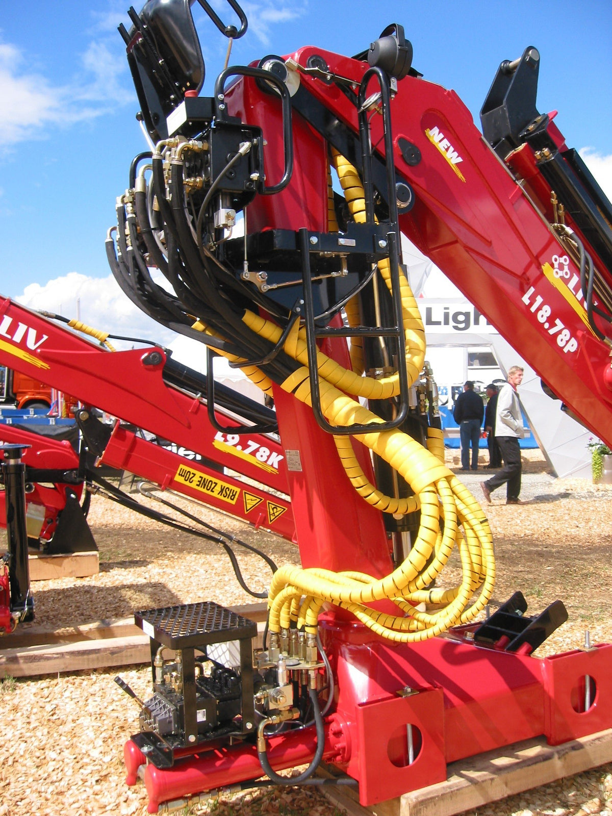 Safe-Spiral SPPC yellow wrap provides abrasion protection for hydraulic hoses.