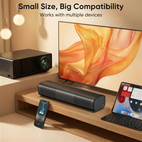 Saiyin side view next to remote showing compact scale and portability