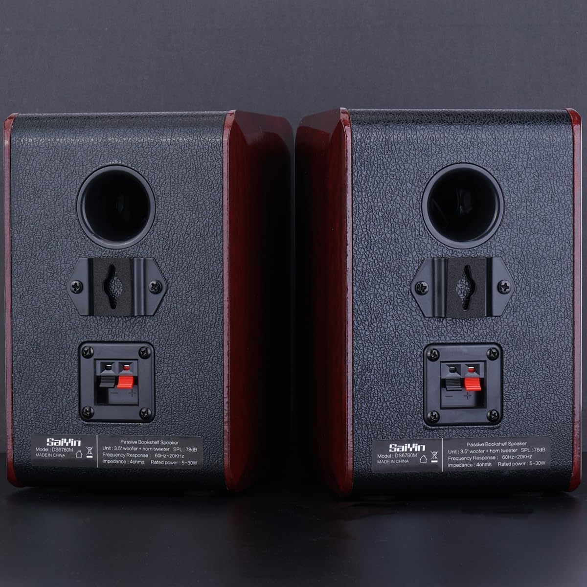 Saiyin speaker beside coffee mug showing compact, space-saving size