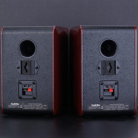 Saiyin speaker beside coffee mug showing compact, space-saving size