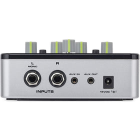 Samson QH4 next to headphones to show compact size and portable convenience for sessions