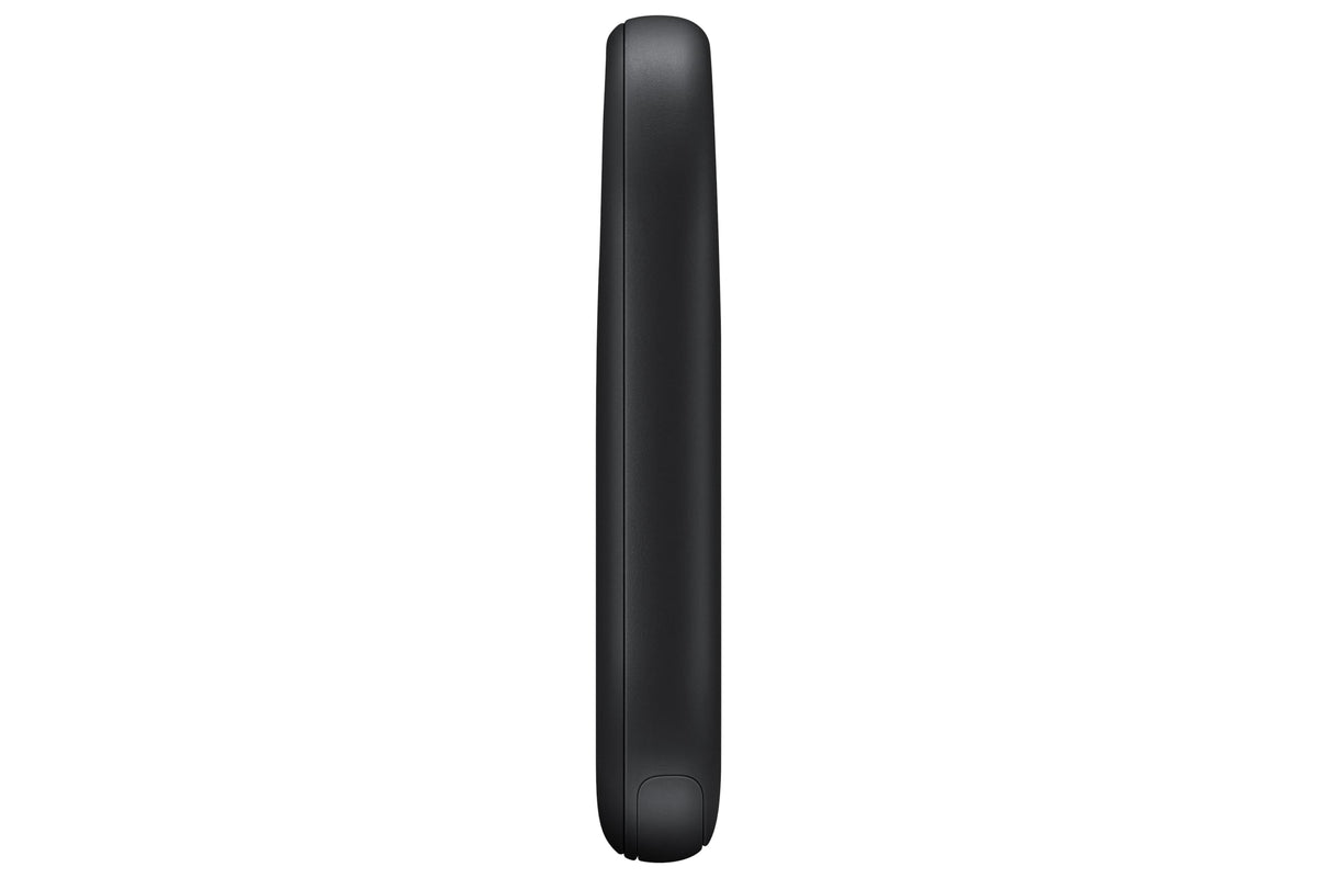 Samsung SmartTag2 next to coin showing compact size and portability