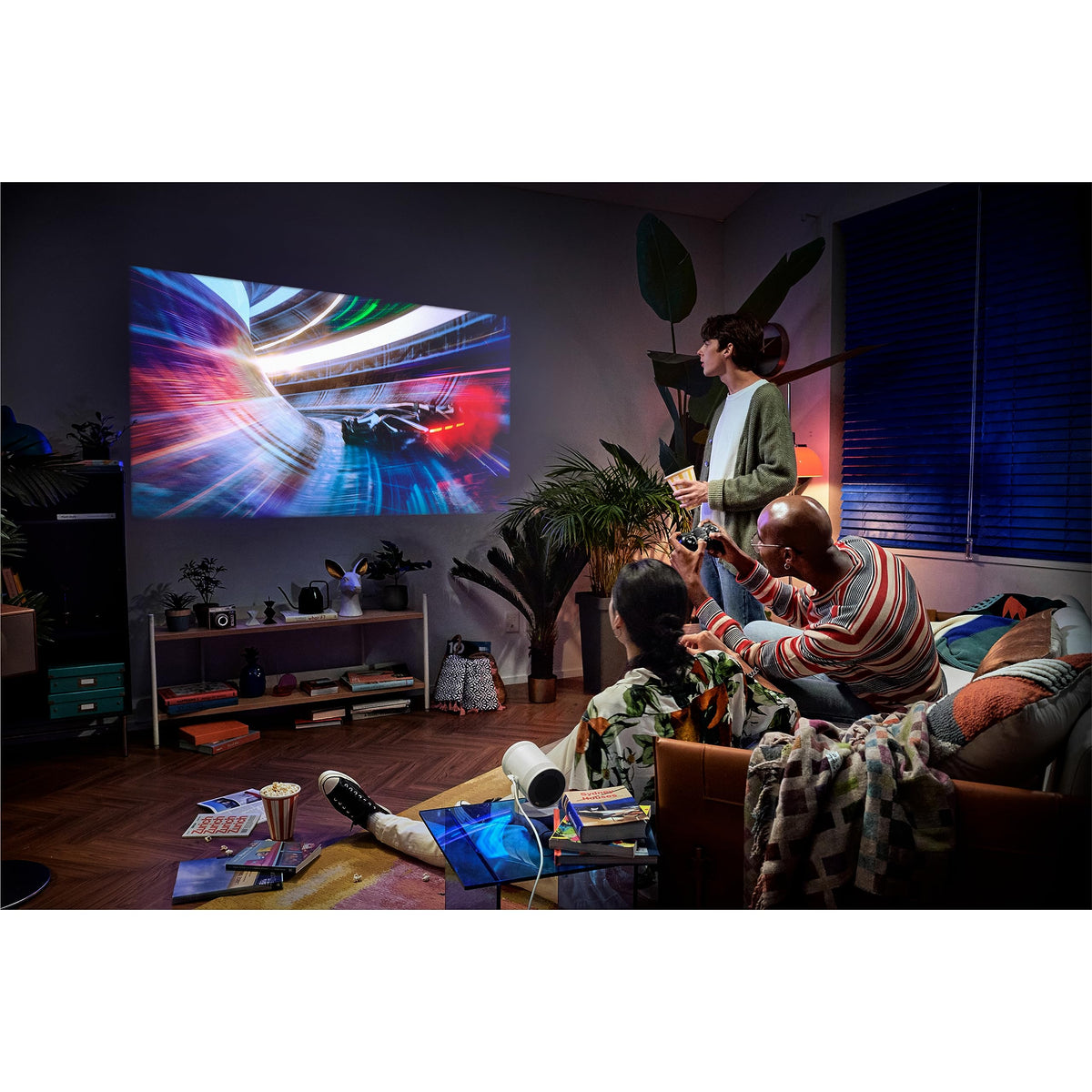 Samsung The Freestyle 2nd Gen remote and ports for easy connectivity.
