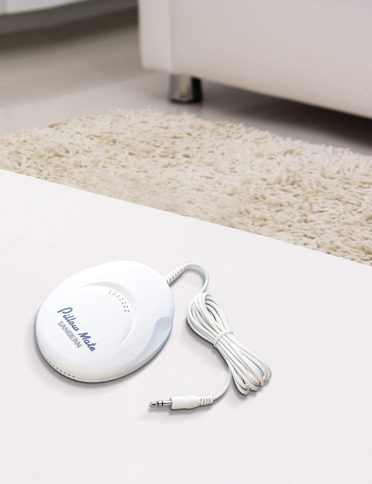 Sangean PS-100 placed under pillow demonstrating quiet bedside listening without disturbance