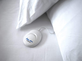 Sangean PS-100 beside smartphone for size comparison and easy 3.5mm wired connection