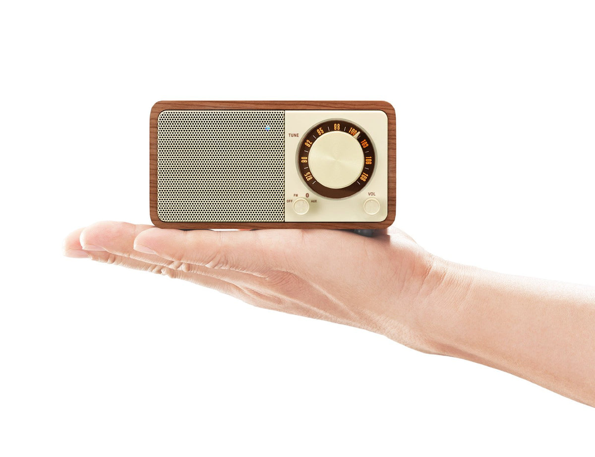 Sangean WR-7WL paired with smartphone on a desk showing Bluetooth convenience