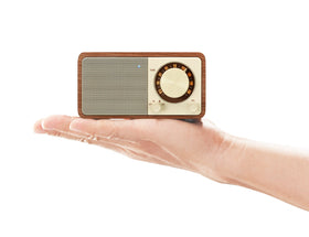 Sangean WR-7WL paired with smartphone on a desk showing Bluetooth convenience