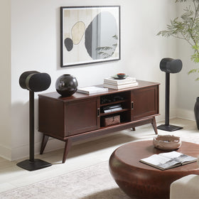 Cable management holes on Sanus ERA 300 stand help hide wires and reduce clutter behind posts