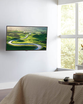 Sanus mount retracts to a slim 3 inch profile for clean walls.