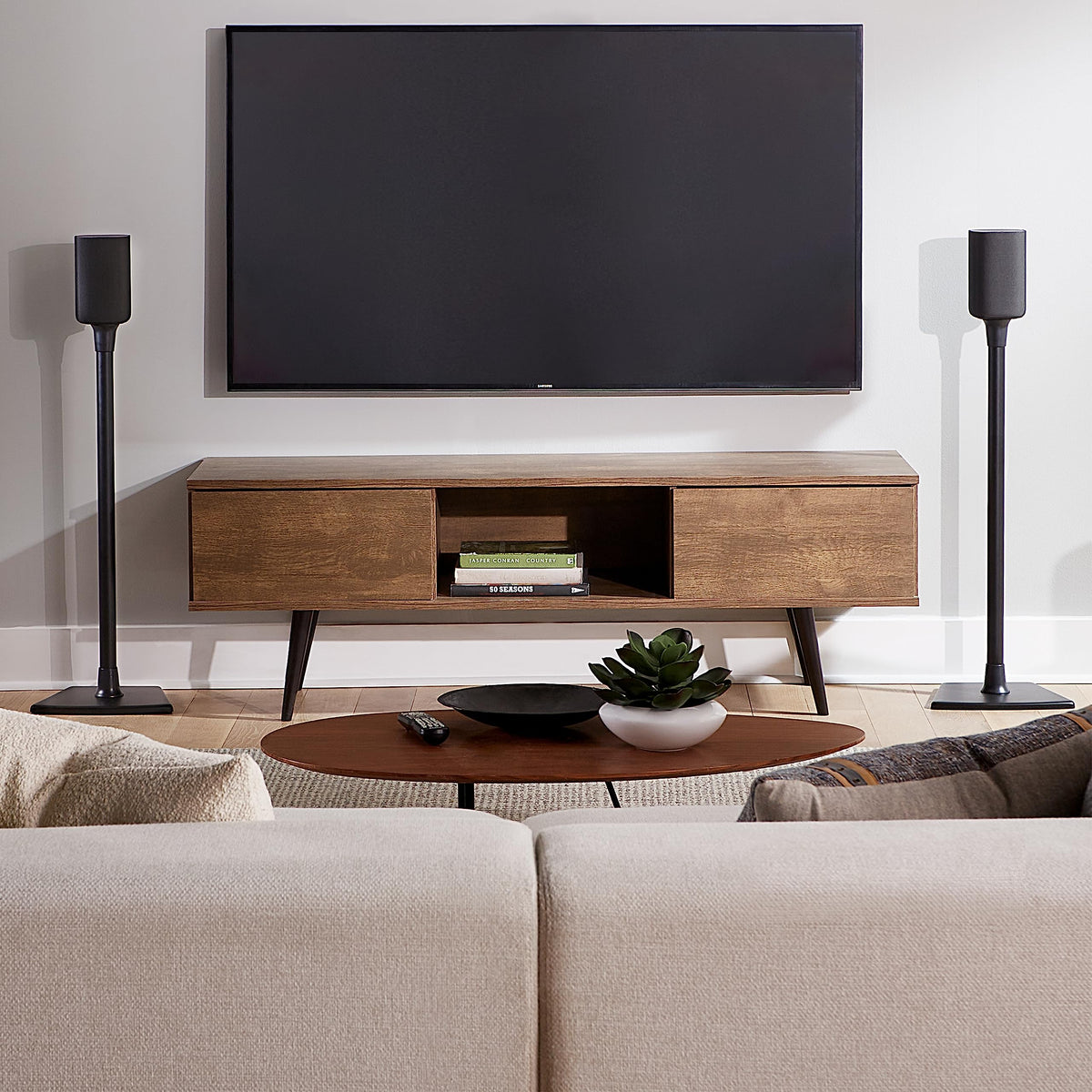 SANUS lifestyle living room setup with stands improving speaker placement and clarity