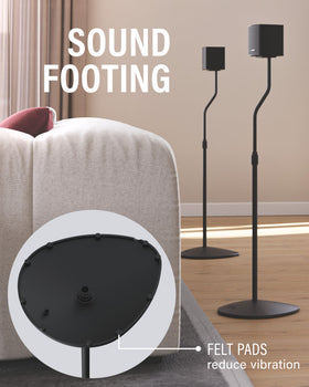 SANUS stands in a living room demonstrating improved speaker positioning