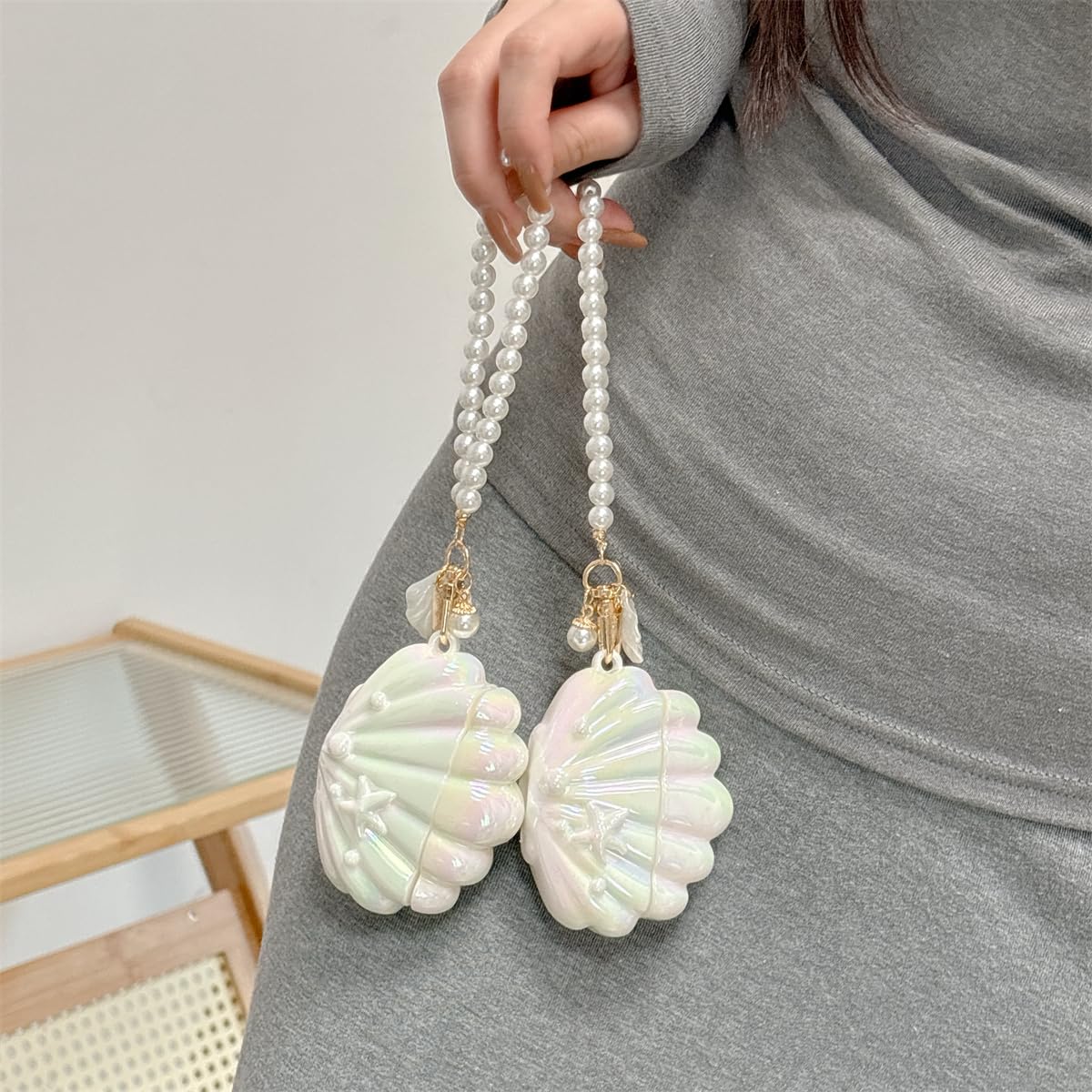 SCQYCWA cute cartoon shell design keeps earbuds stylish and portable.
