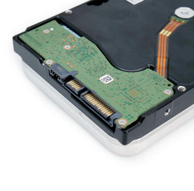 Label on Seagate Exos 28TB drive displaying capacity and MTBF details.