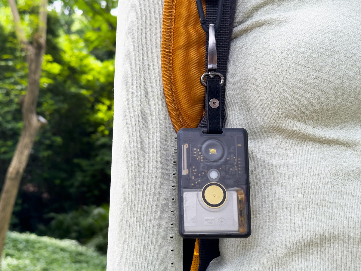Seeed Studio T1000-E held in hand to show compact scale and portable benefit