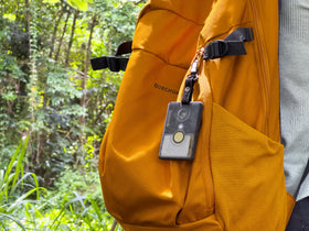 Seeed Studio T1000-E mounted on outdoor gear demonstrating rugged tracking integration