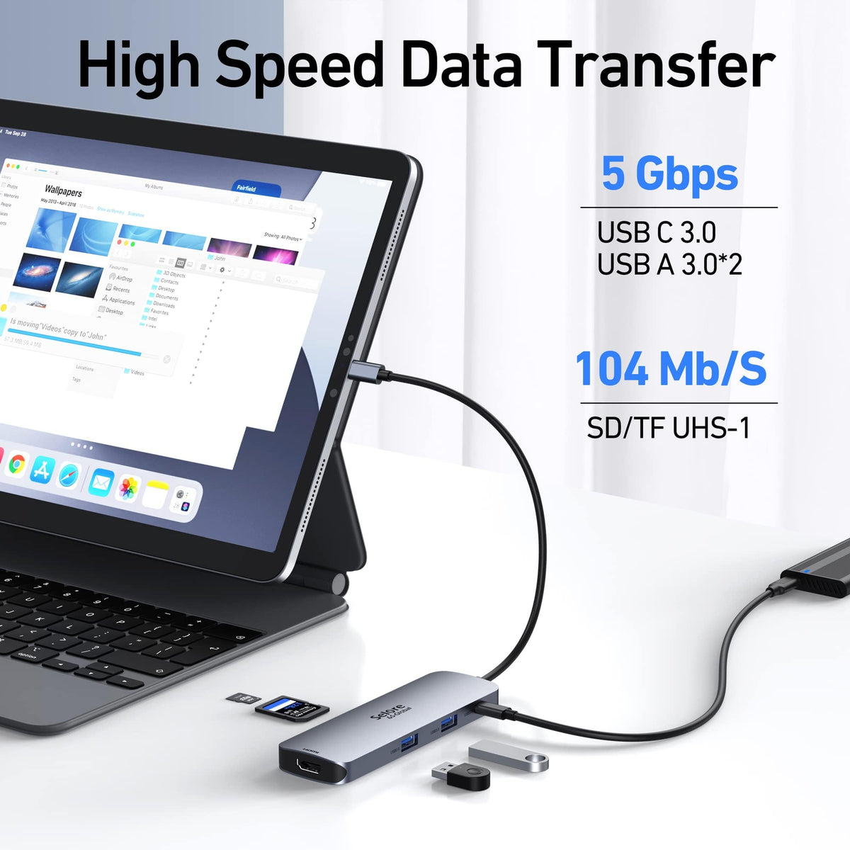 Selore&S-Global shown next to a laptop and USB-C cable to show scale and portability benefit