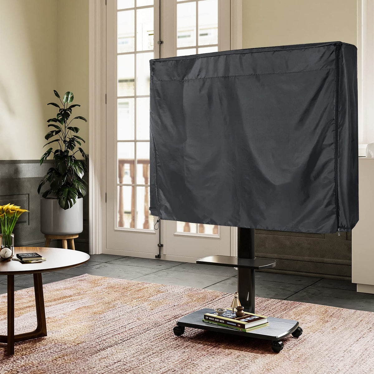 SELUGOVE covered TV cart on patio showing weather protection benefit
