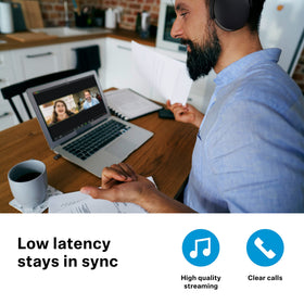Sennheiser headphones paired to BTD 600 in use delivering low latency audio benefit synced video