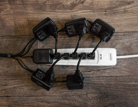 Sewell in-use office desk setup featuring the outlet saver cables.