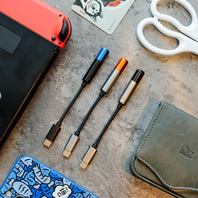 SHANLING UA MINI beside a wallet for scale, ultra-compact design fits in pocket