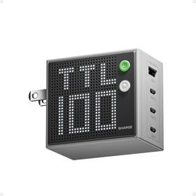 SHARGE Pixel 100 charger on desk with four ports for versatile fast charging.