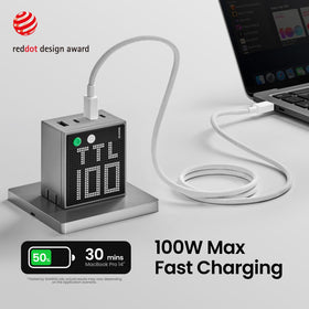 SHARGE Pixel 100 four-port setup charges laptop, phone, and tablet simultaneously.