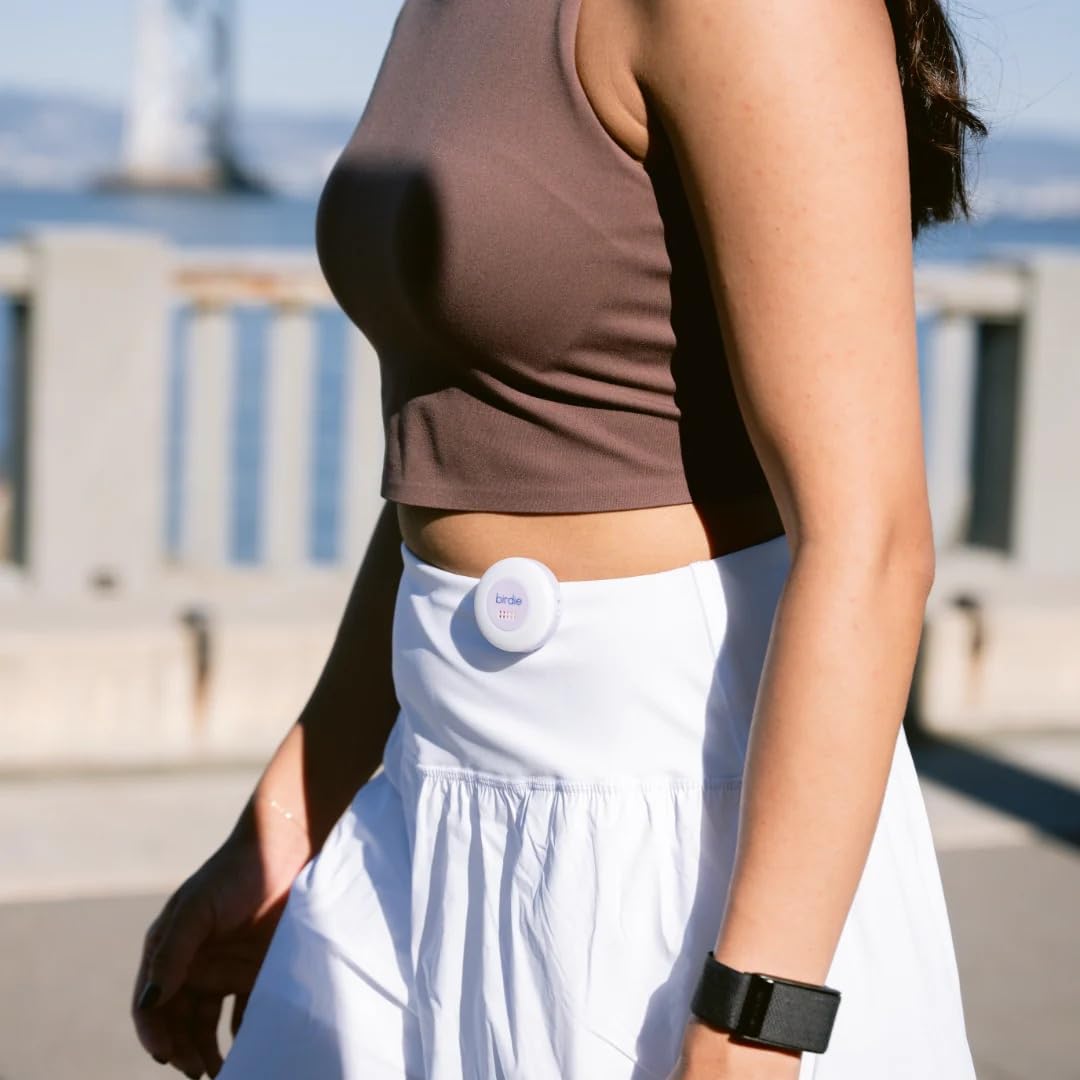 She's Birdie clipped to backpack strap offering hands-free access and immediate alerting