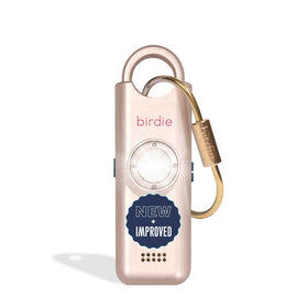 She’s Birdie metallic rose pink front view showing compact alarm and easy carry benefit