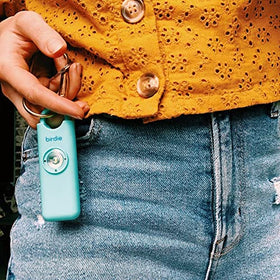 She’s Birdie on a woman’s bag while walking showing confidence and peace-of-mind benefit