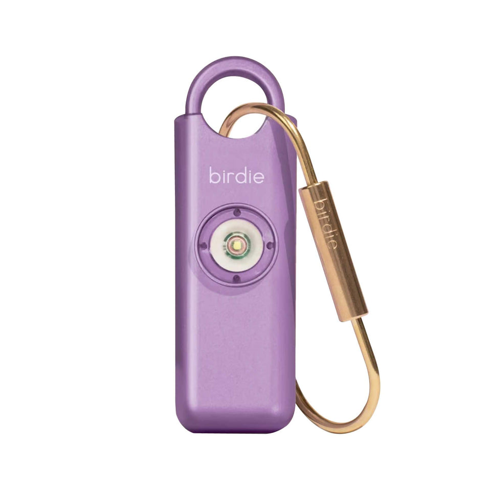 She’s Birdie metallic lavender front view showing compact alarm and key ring benefit visibility