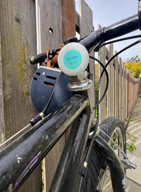 She's Birdie connected to USB charging port indicating rechargeable convenience