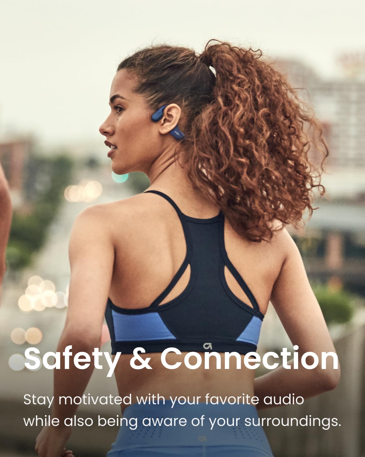 SHOKZ OpenRun Mini built-in mic for clear calls while exercising.