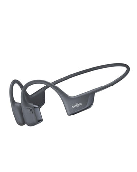 SHOKZ OpenRun Pro 2 open-ear design on a runner for safe, aware listening.