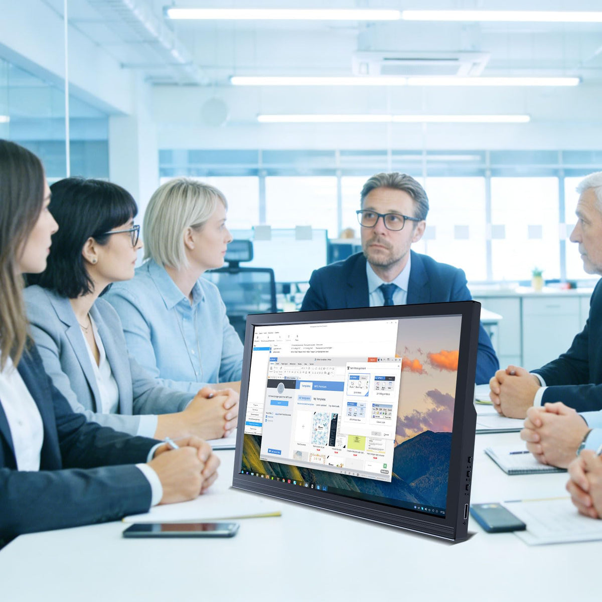 Showscren beside laptop showing 17.3-inch scale for travel and workspace planning benefit
