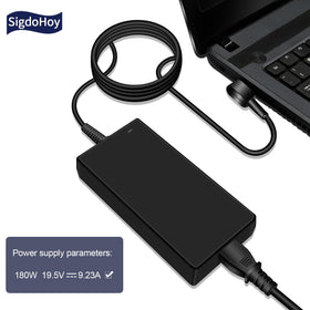 SigdoHoy 180W charger on desk beside gaming laptop.
