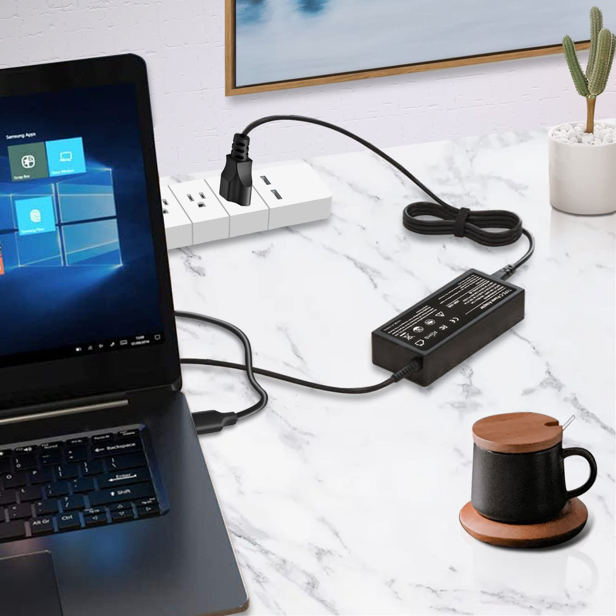 SiKER charger on a desk powering a laptop and phone for a tidy multifunction workspace