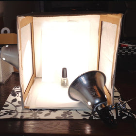 Simple Deluxe lamp brightening a photo studio setup for tasks.