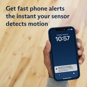 SimpliSafe motion sensor beside a hand to show compact size and discreet home protection