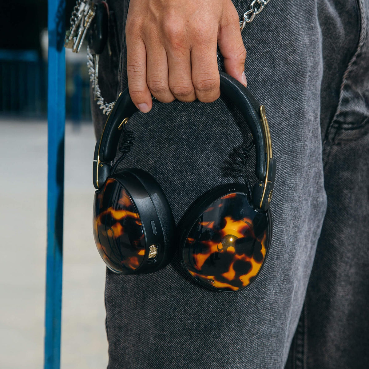 Wearing Aviator 900 ANC for immersive listening and active noise control.