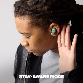 Skullcandy Dime Evo earbuds close-up highlighting texture and fit, improves clarity