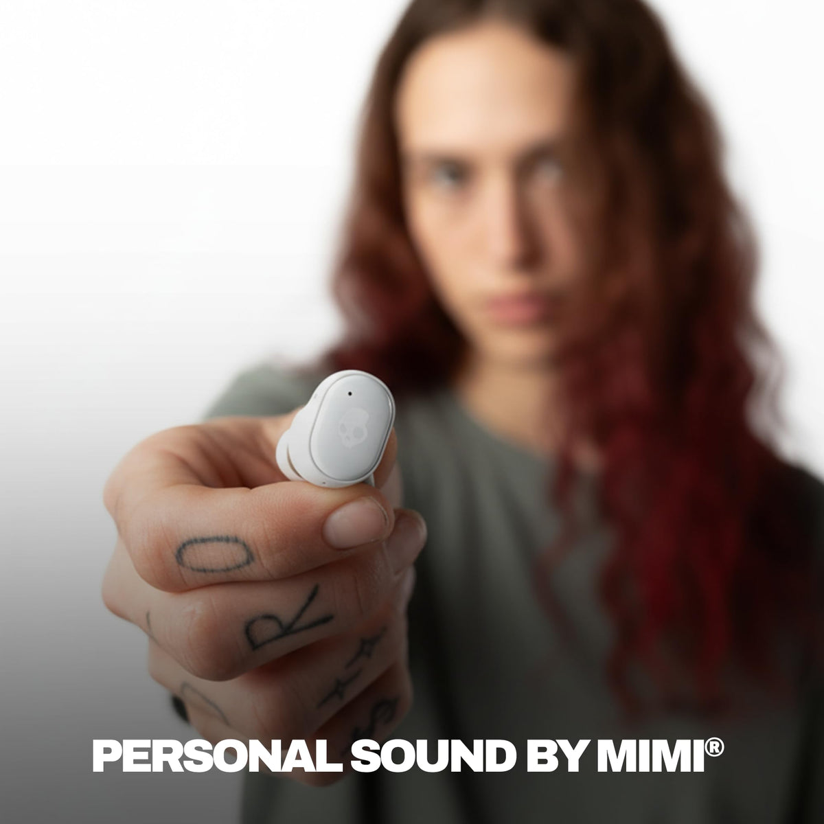 Skullcandy Grind earbud close-up highlighting texture and comfortable fit benefit