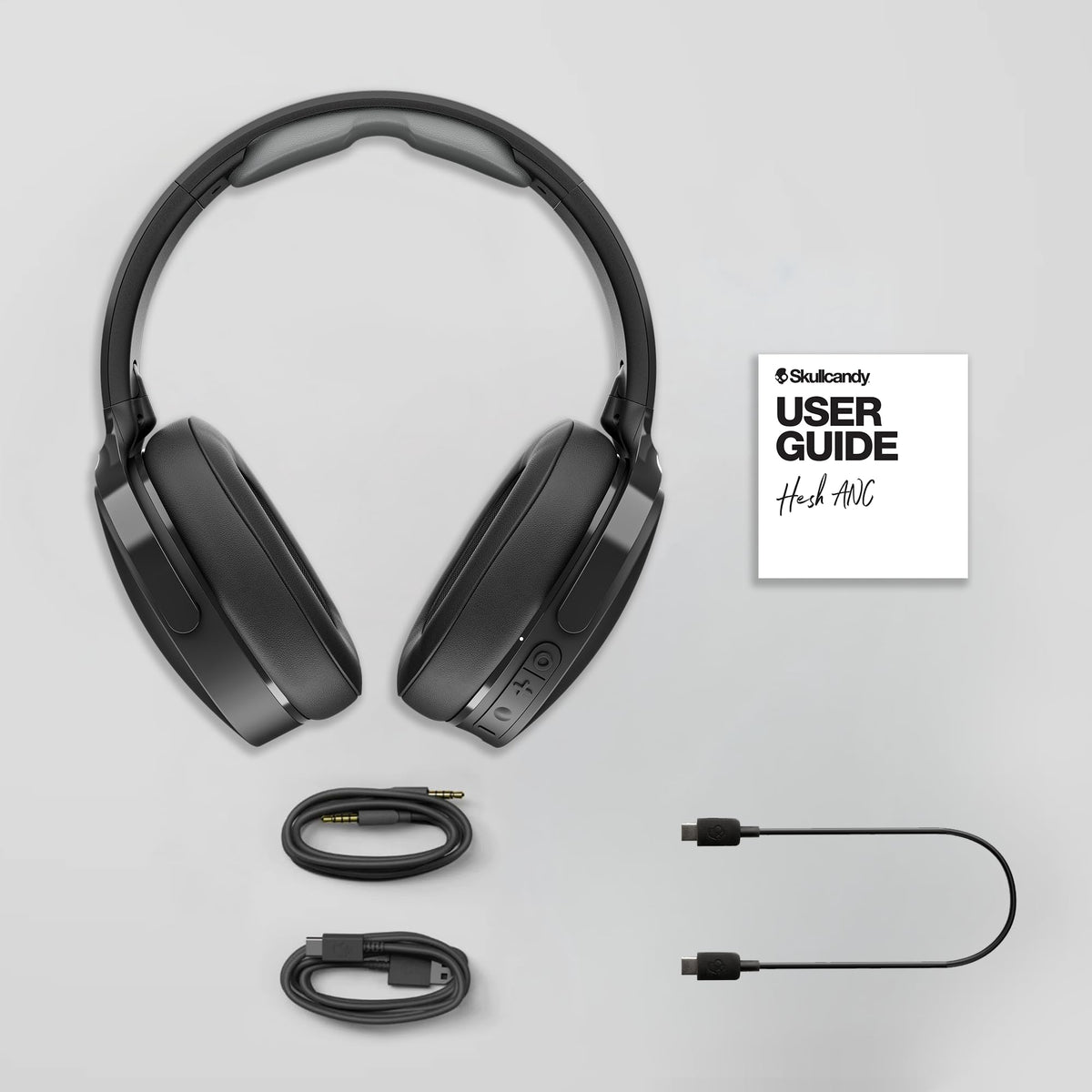 Skullcandy Hesh ANC headphones controls on ear cup for calls and playback.