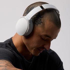 Person wearing Skullcandy Hesh Evo during commute for everyday portability