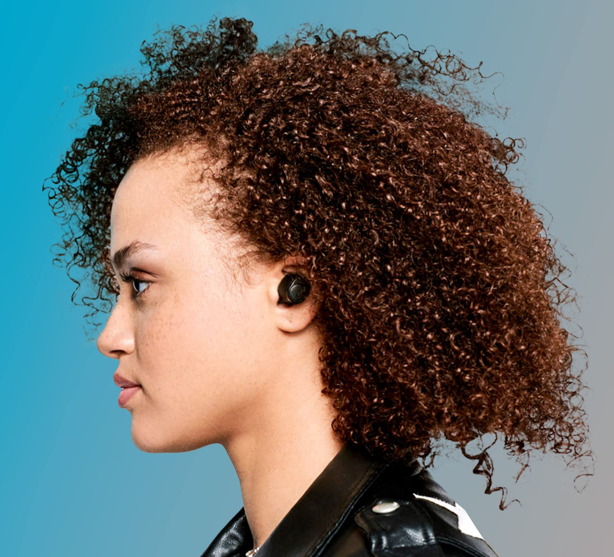 Person wearing Skullcandy Jib True 2 while jogging, showing sweat-resistant performance benefit