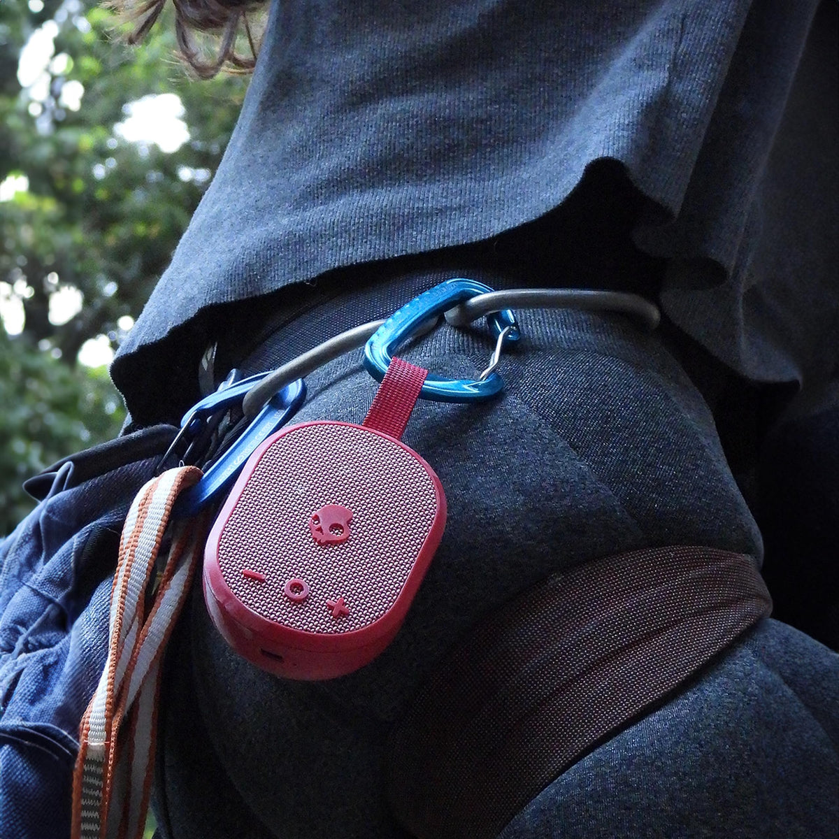 Skullcandy Ounce ballistic nylon strap for hands-free carry.