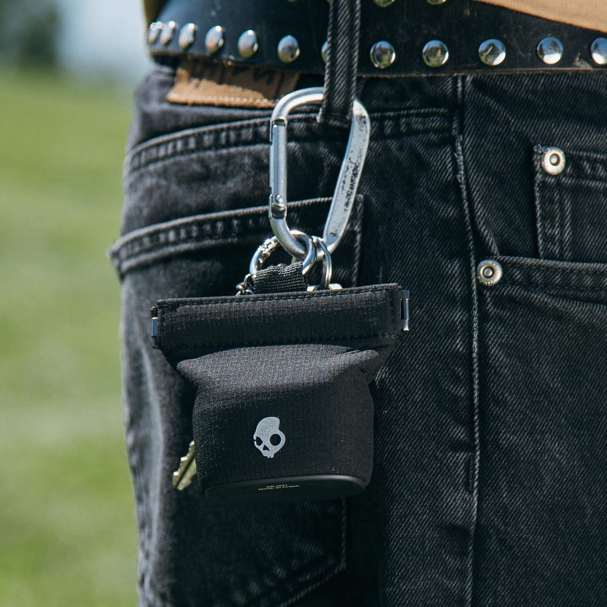 Wireless charging pouch eliminates cable clutter while keeping earbuds ready.