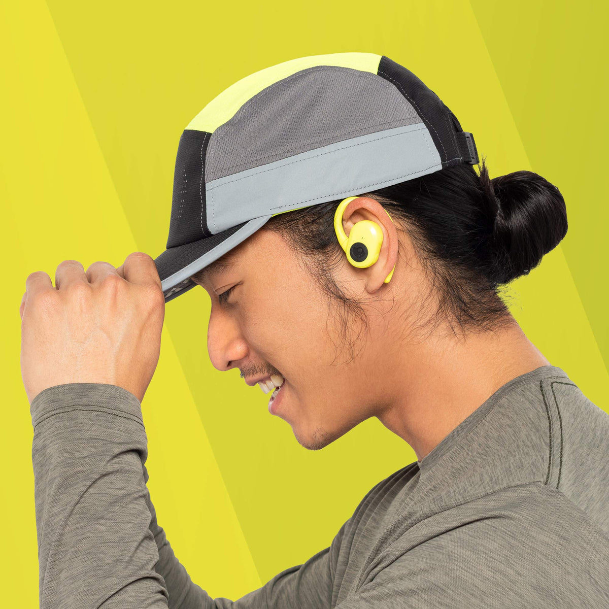 Skullcandy earbuds in ear while running outdoors, showing sweat resistance